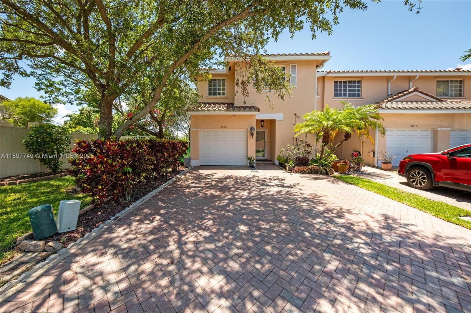 3869 Northwest 92nd Avenue Sunrise, FL 33351 - Photo 2 of 40 a view of a house with a street