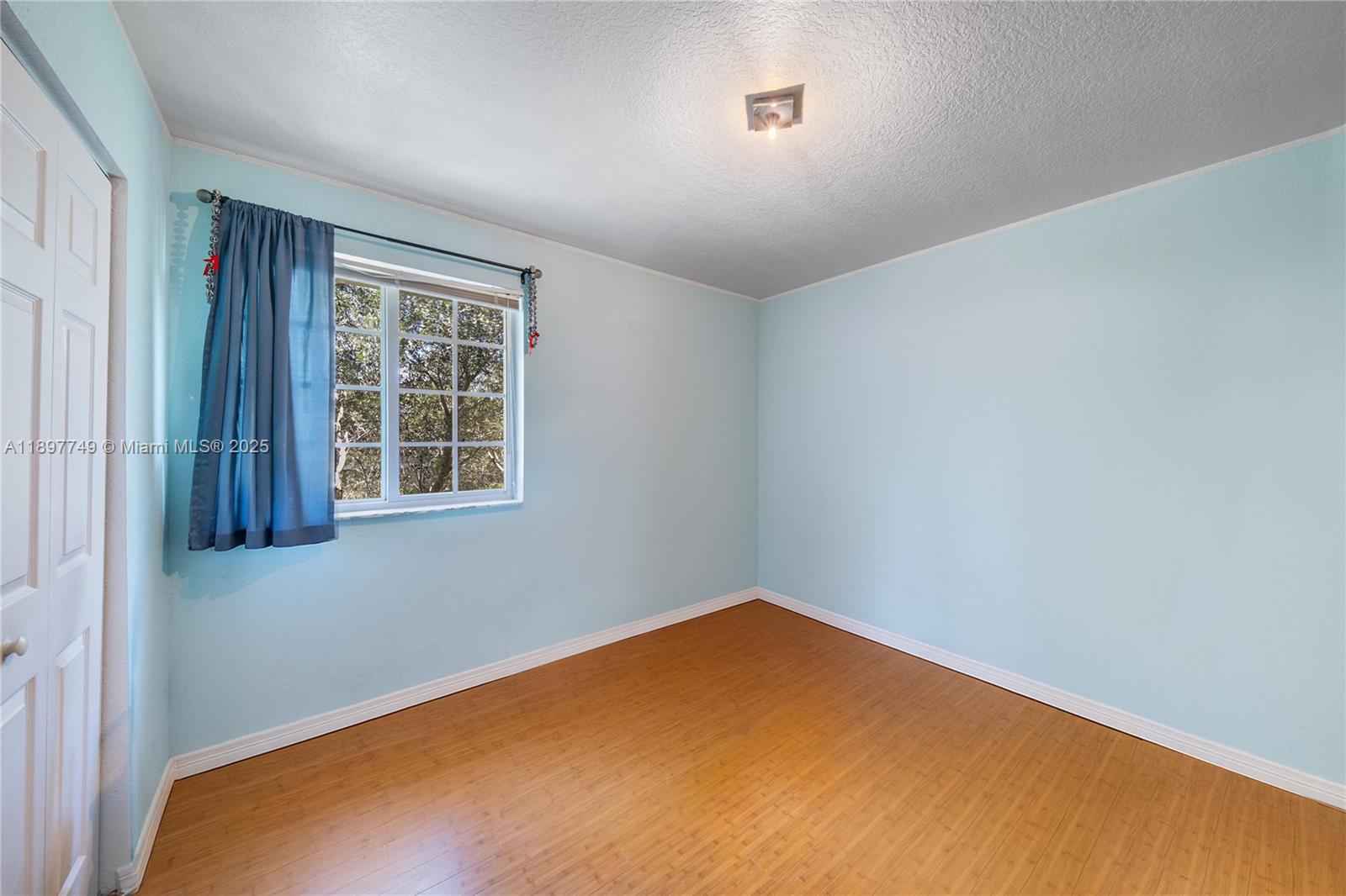 3869 Northwest 92nd Avenue Sunrise, FL 33351 - Photo 27 of 40 an empty room with windows