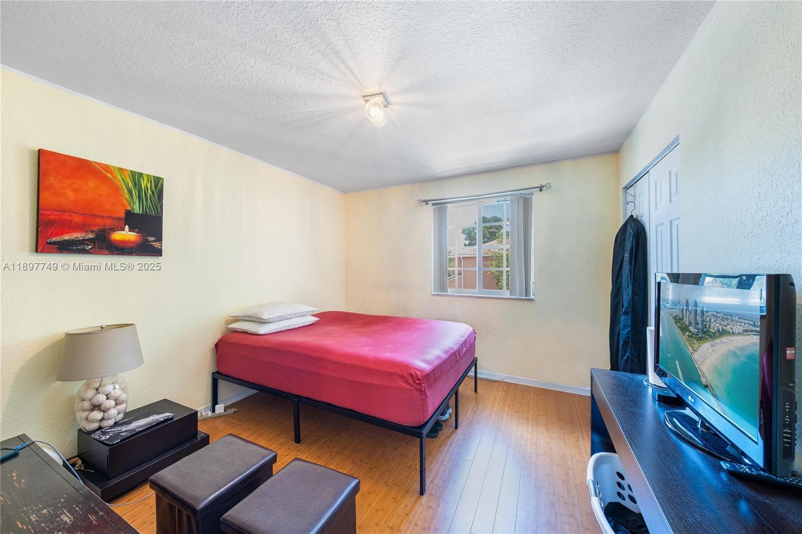 3869 Northwest 92nd Avenue Sunrise, FL 33351 - Photo 28 of 40 a living room with furniture and a flat screen tv