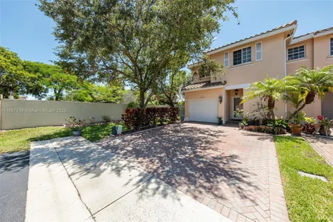 a pathway of a house with a yard