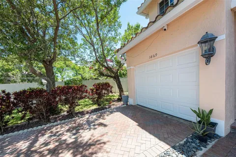 an aerial view of a house with a garden