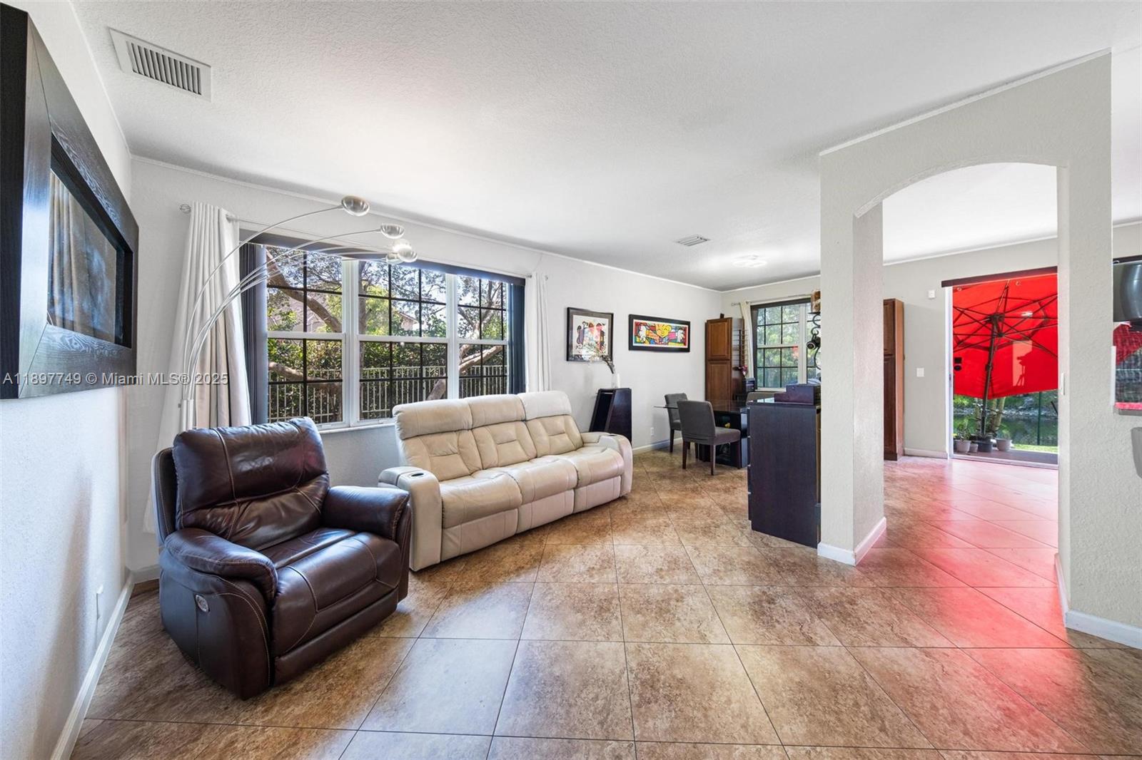 3869 Northwest 92nd Avenue Sunrise, FL 33351 - Photo 9 of 40 a living room with furniture and a large window
