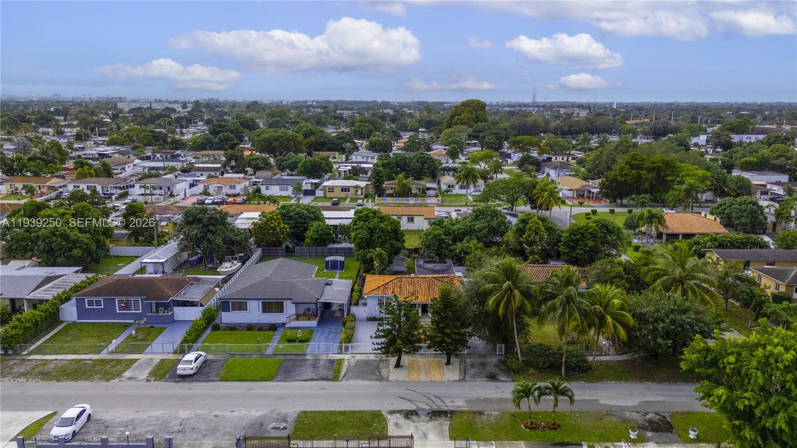 116 East 59th Street Hialeah, FL 33013 - Photo 1 of 51 an aerial view of house with yard swimming pool and lake view