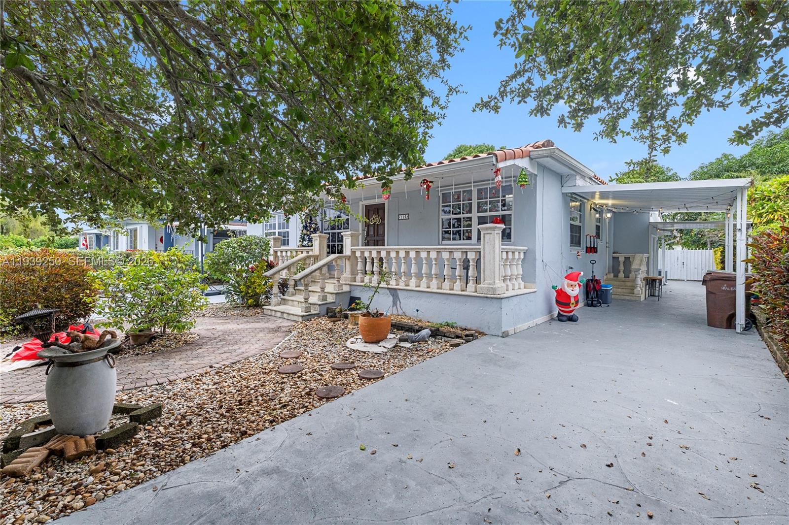116 East 59th Street Hialeah, FL 33013 - Photo 17 of 51 a front view of a house with a patio