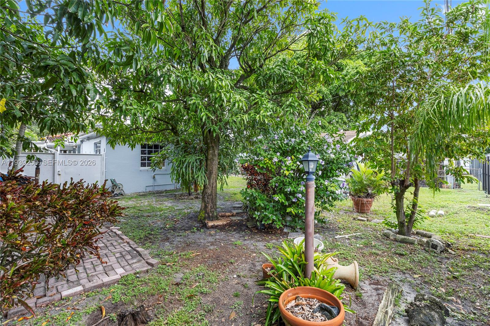 116 East 59th Street Hialeah, FL 33013 - Photo 20 of 51 a front view of a house with garden