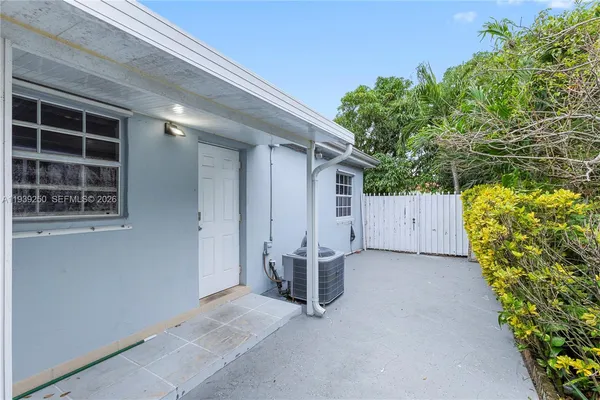a room with furniture and a potted plant