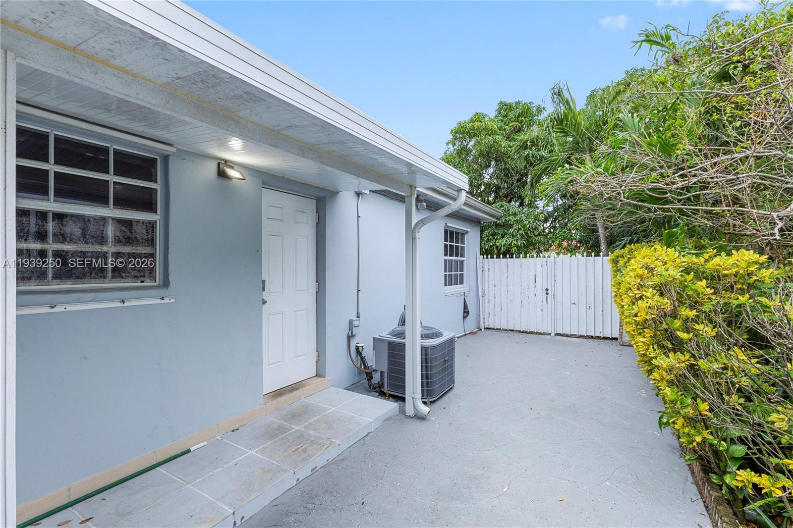 116 East 59th Street Hialeah, FL 33013 - Photo 24 of 51 a view of a house with a plant plant and a window