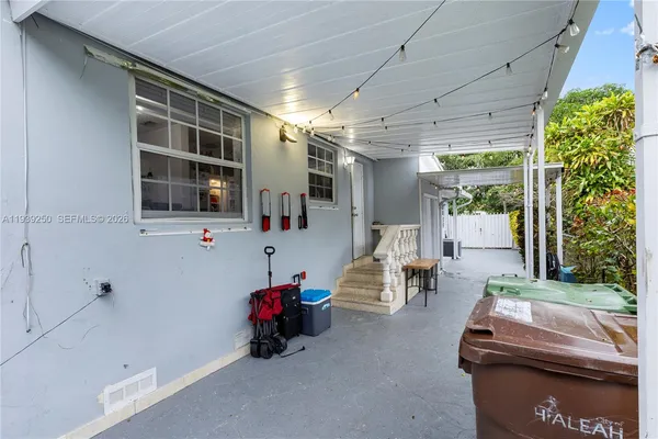 a balcony with furniture and flowers