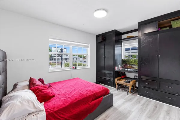 a bedroom with a bed and a closet