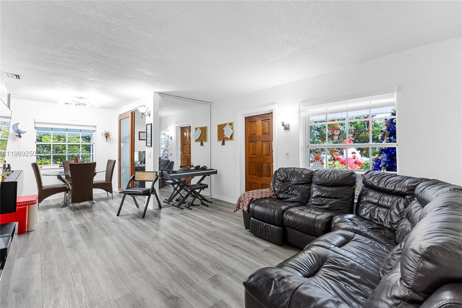 116 East 59th Street Hialeah, FL 33013 - Photo 34 of 51 a living room with furniture and a large window