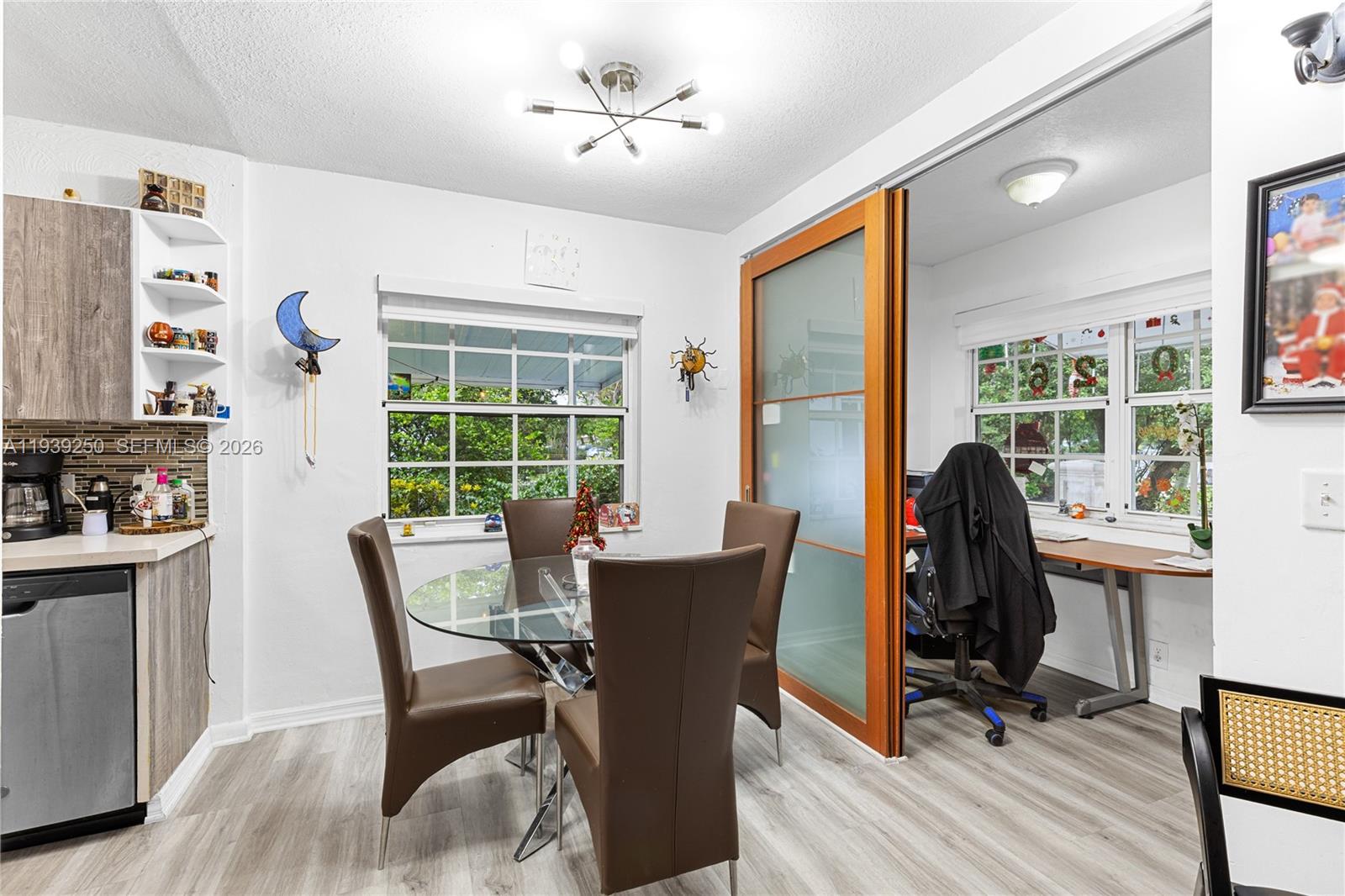 116 East 59th Street Hialeah, FL 33013 - Photo 47 of 51 a view of a dining room with furniture window and outside view