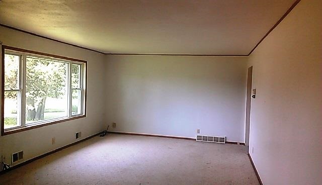 4170 Rotary Road Rockford, IL 61109 - Photo 7 of 13 an empty room with a empty space and windows
