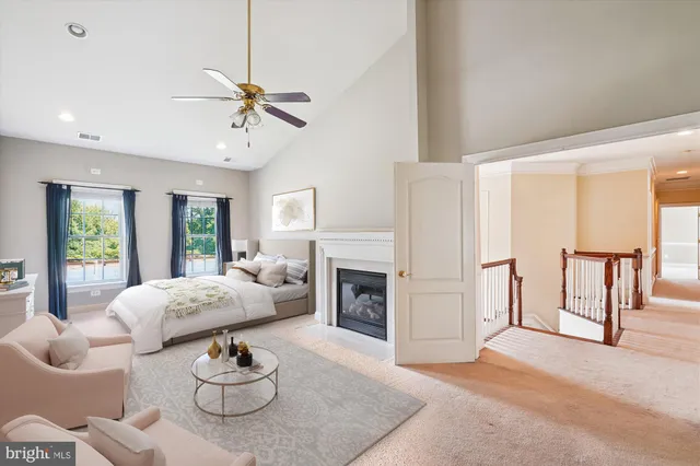 an empty room with closet and a ceiling fan