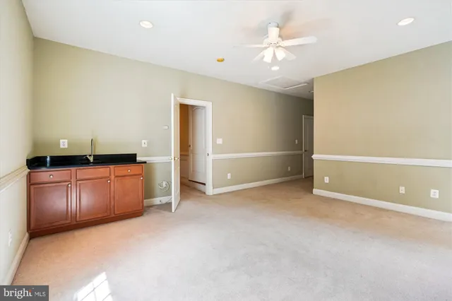 a bathroom with a sink toilet vanity and shower