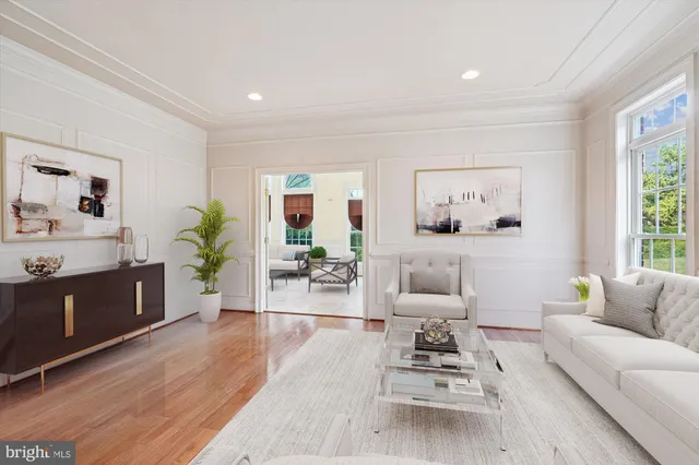 a open dining room with stainless steel appliances kitchen island granite countertop a table chairs and a refrigerator