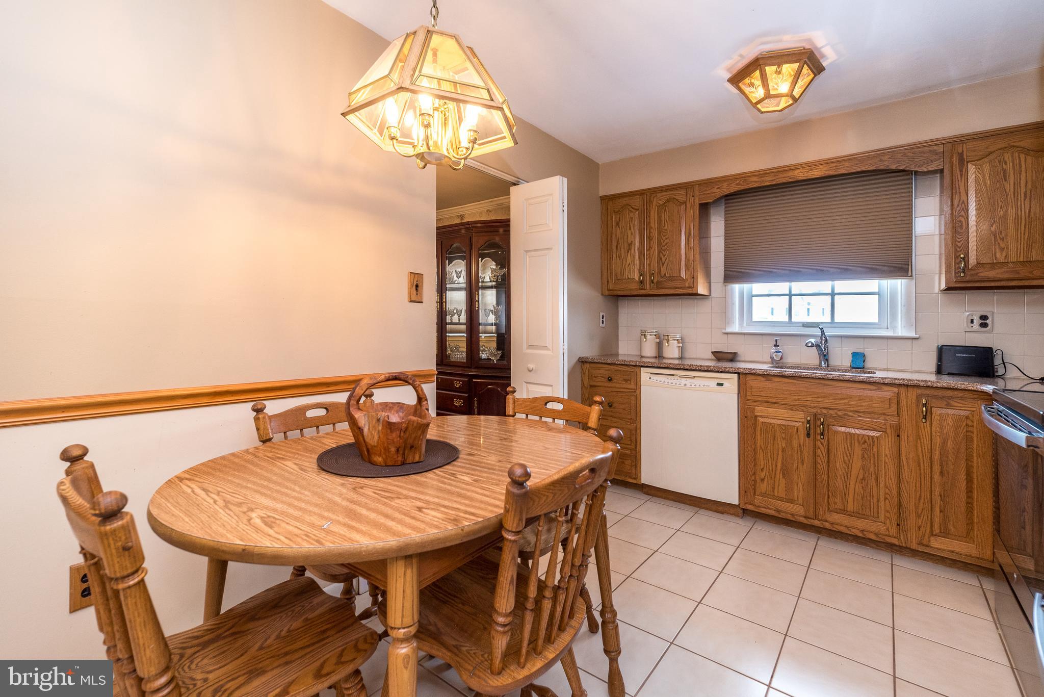 364 Abrams Mill Road King of Prussia, PA 19406 - Photo 19 of 43 a kitchen with a sink cabinets and window