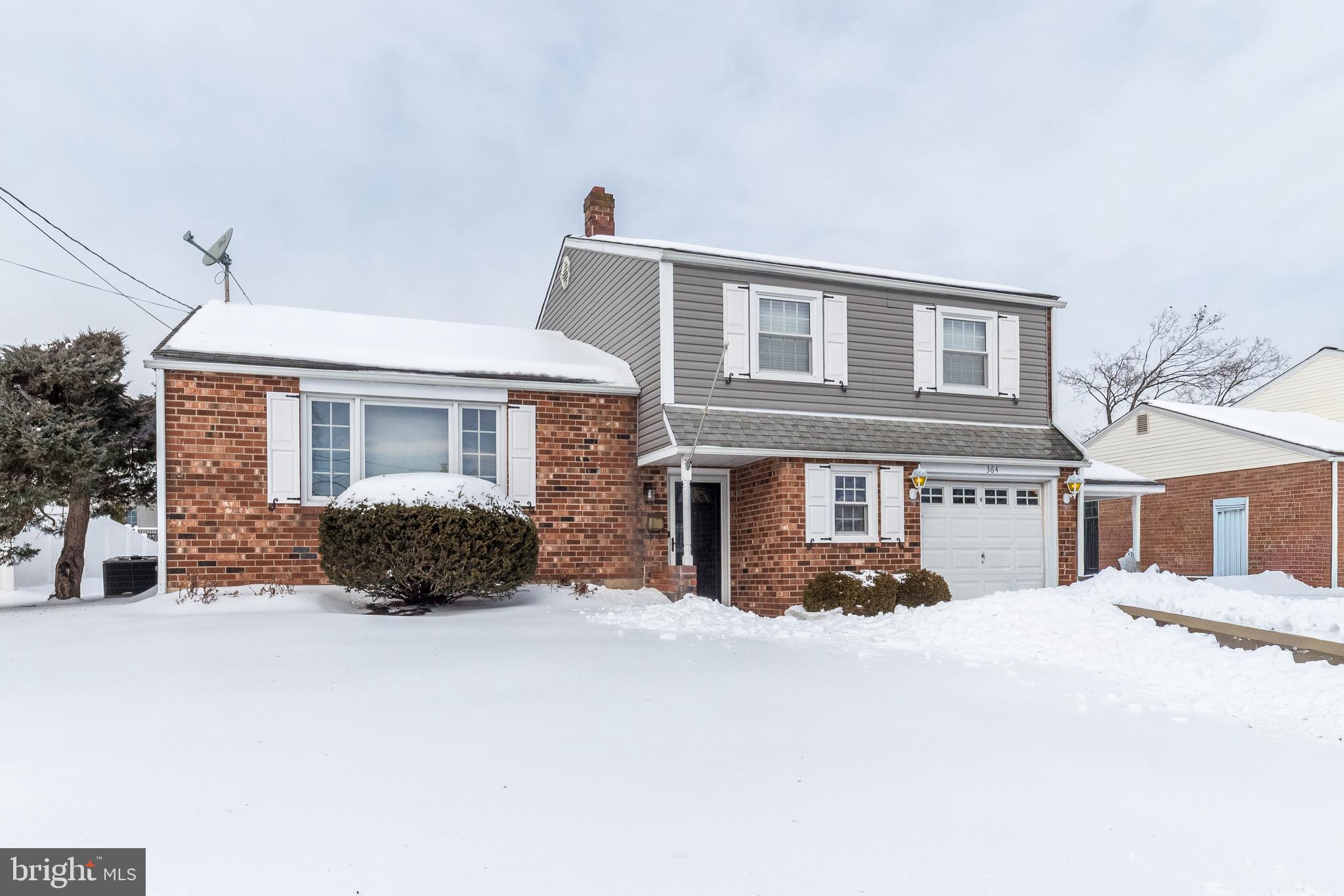 364 Abrams Mill Road King of Prussia, PA 19406 - Photo 3 of 43 a front view of a house with a yard