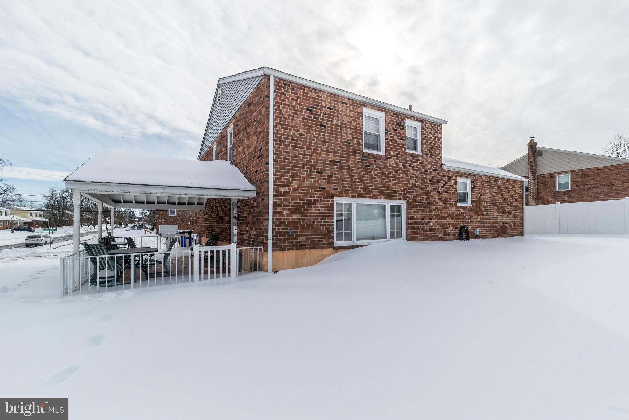 364 Abrams Mill Road King of Prussia, PA 19406 - Photo 4 of 43 a view of a patio with a table and chairs under an umbrella