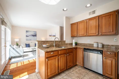 a view of a kitchen with a dining table and chairs