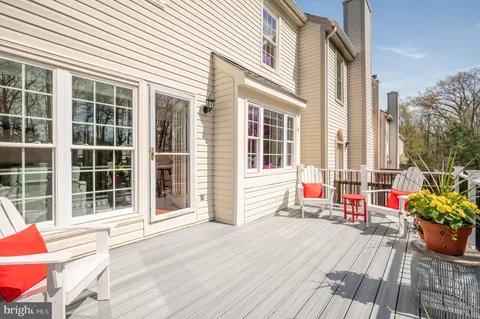 a view of sitting space with wooden deck and furniture