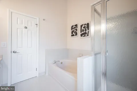 a view of a ceiling fan and a window