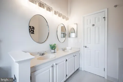 a view of a hallway with a ceiling fan