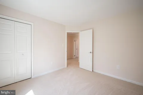 an empty room with a fireplace