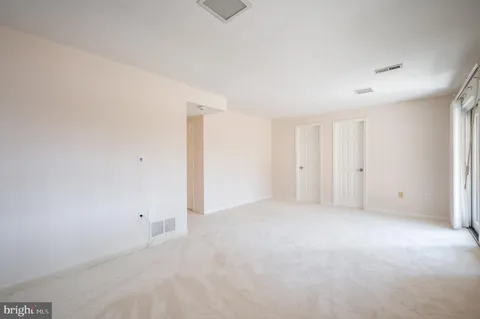 a view of a chairs and tables in the back yard of the house