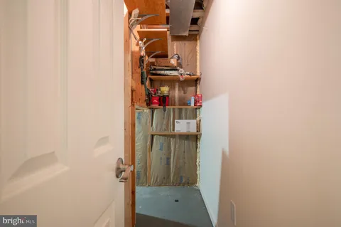 a view of a porch with a table and chairs