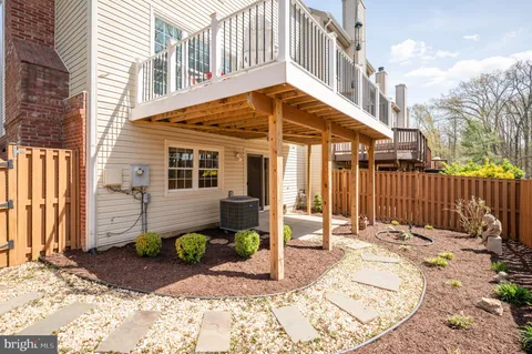 a swimming pool with outdoor seating and yard