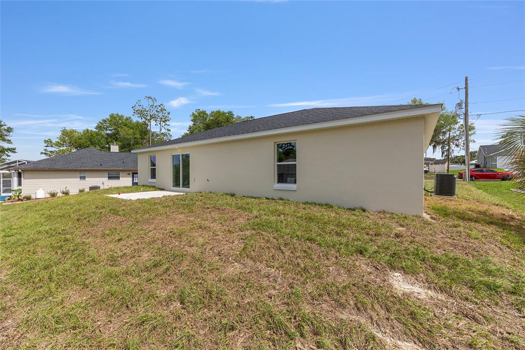 13031 Northeast 7th Loop Silver Springs, FL 34488 - Photo 32 of 34 a house view with a backyard space