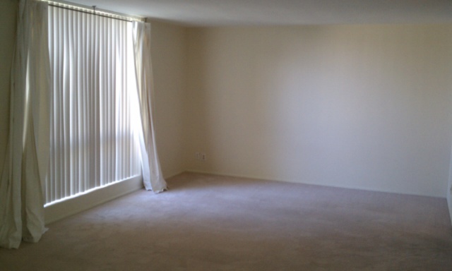 3242 East Camelback Road, Unit 108 Phoenix, AZ 85018 - Photo 6 of 13 an empty room with windows