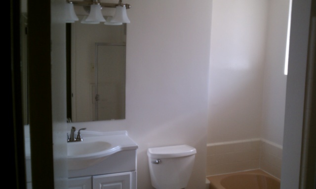 3242 East Camelback Road, Unit 108 Phoenix, AZ 85018 - Photo 9 of 13 a bathroom with a sink and toilet