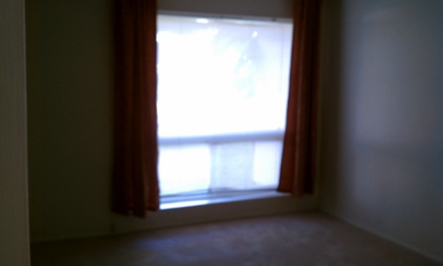 3242 East Camelback Road, Unit 108 Phoenix, AZ 85018 - Photo 10 of 13 a view of an empty room and window