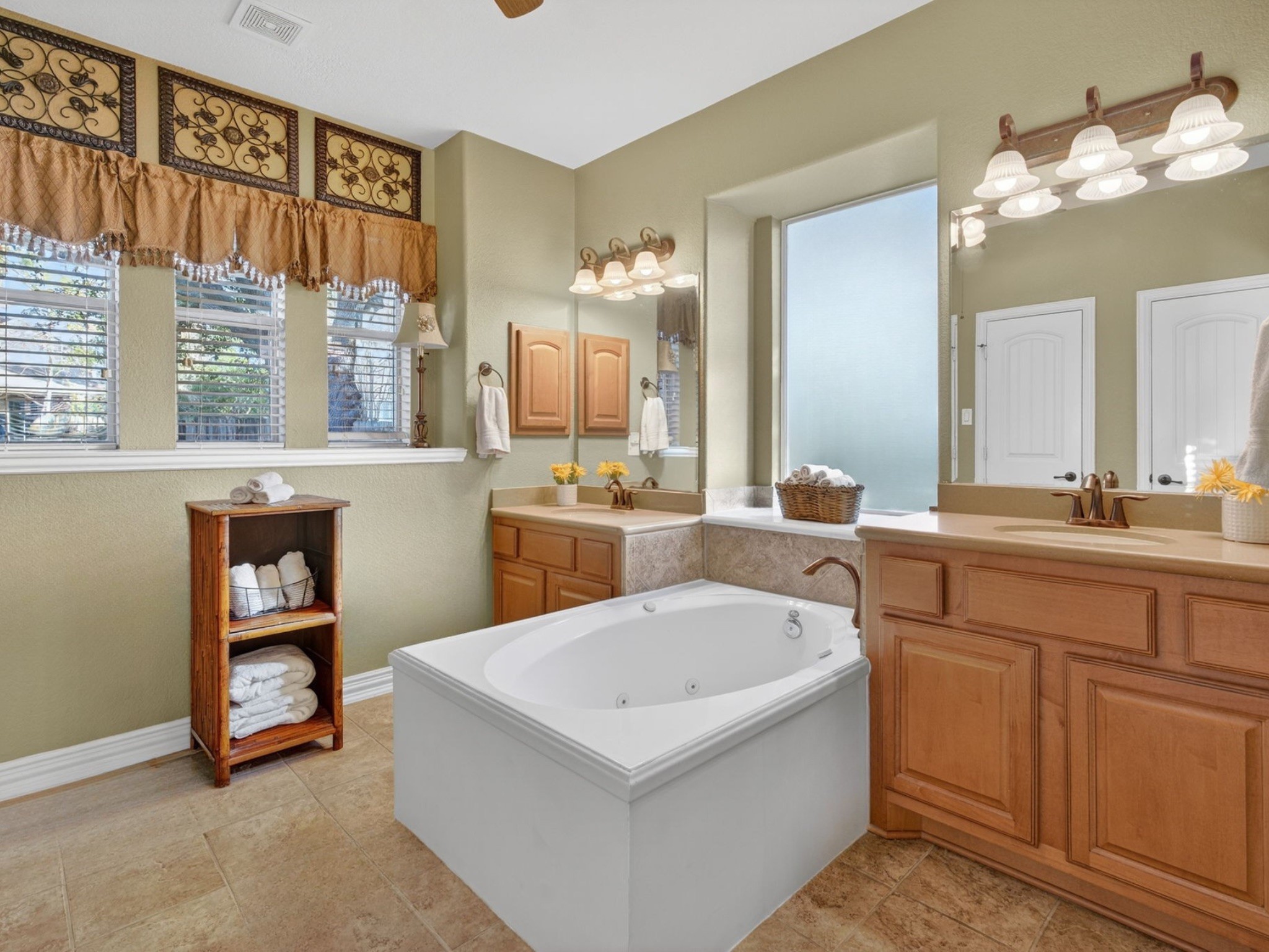 194 Maple Grove Drive Conroe, TX 77384 - Photo 14 of 25 a bathroom with a sink a vanity and a mirror