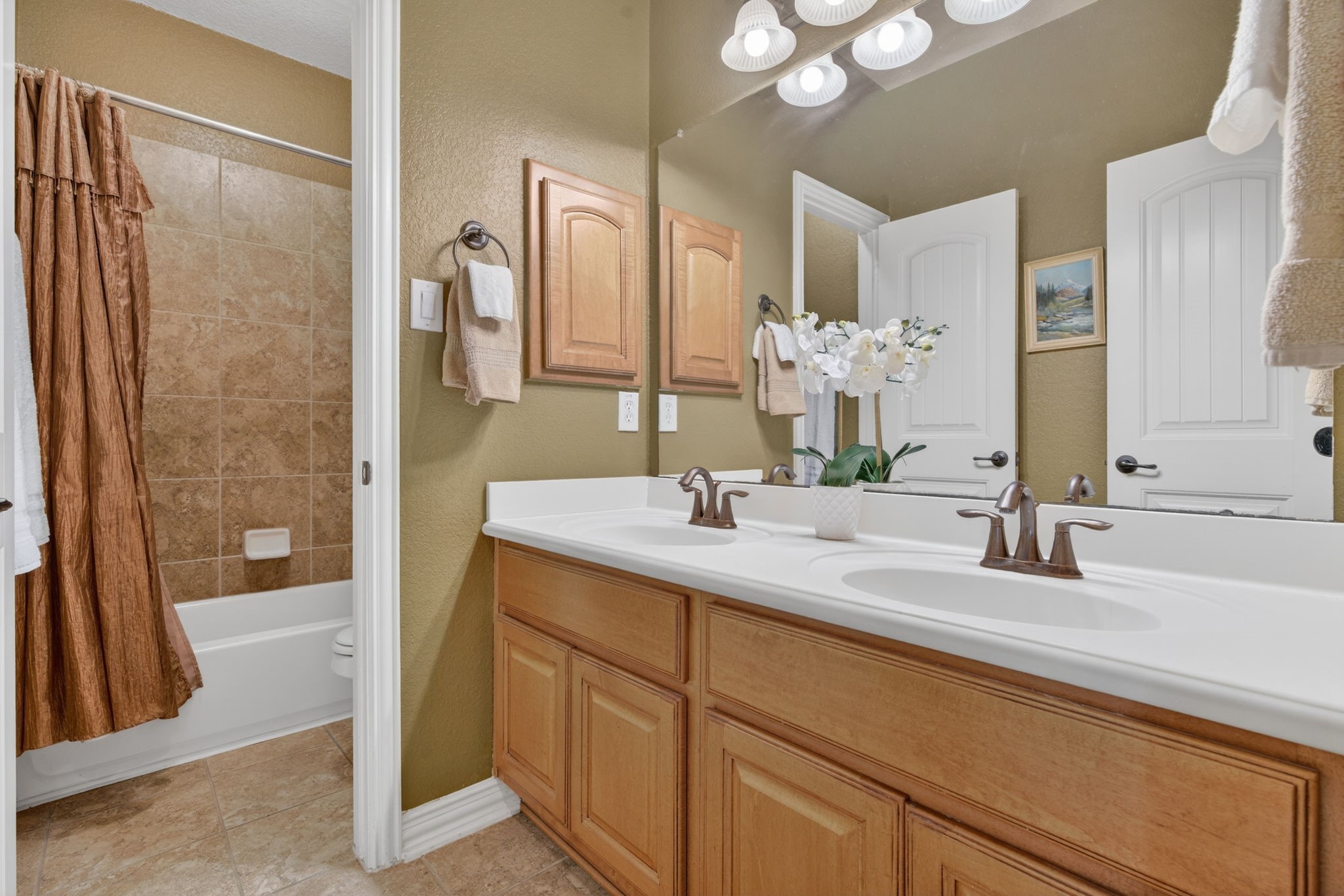 194 Maple Grove Drive Conroe, TX 77384 - Photo 18 of 25 a bathroom with a double vanity sink mirror and shower