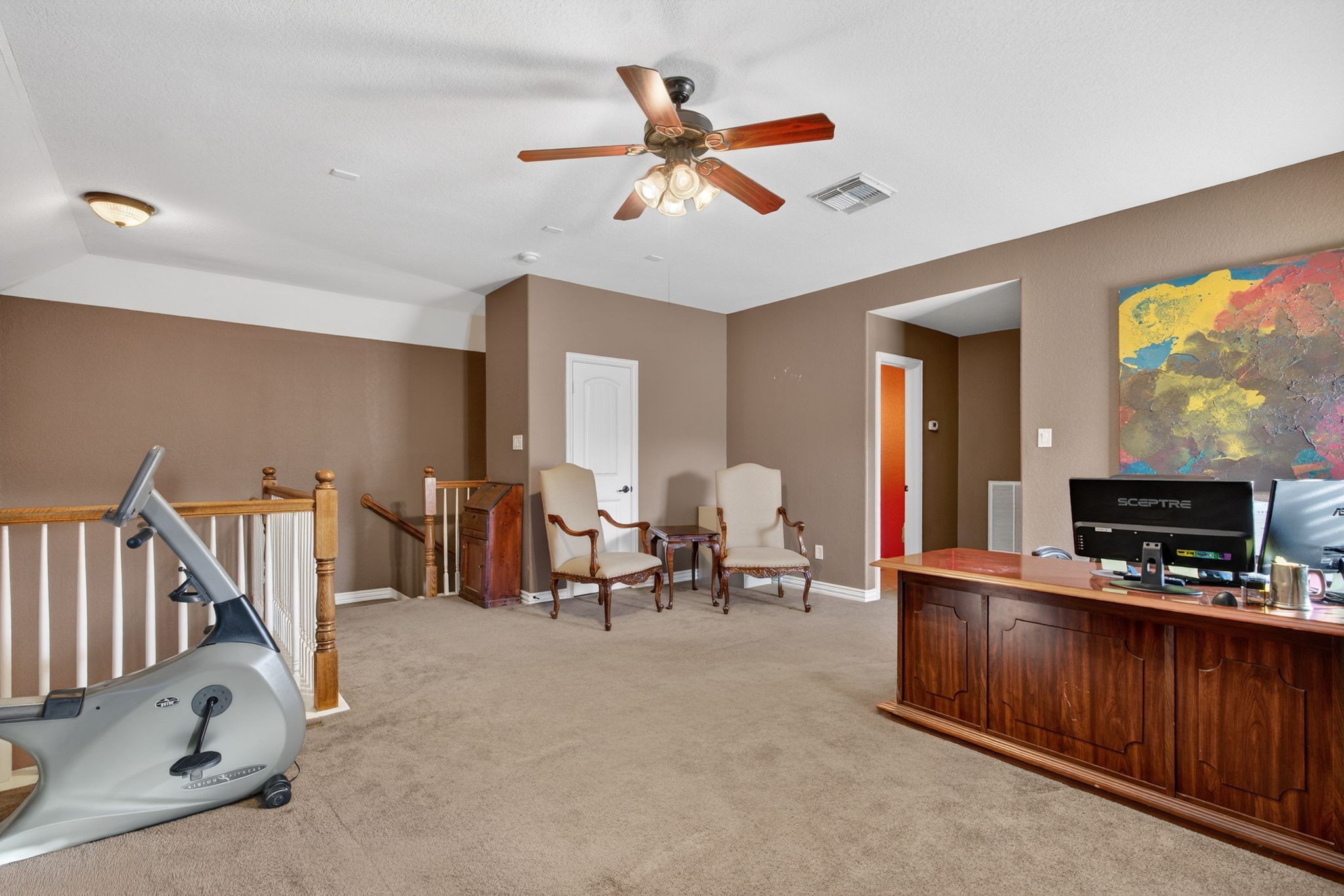 194 Maple Grove Drive Conroe, TX 77384 - Photo 19 of 25 a living room with furniture and a flat screen tv