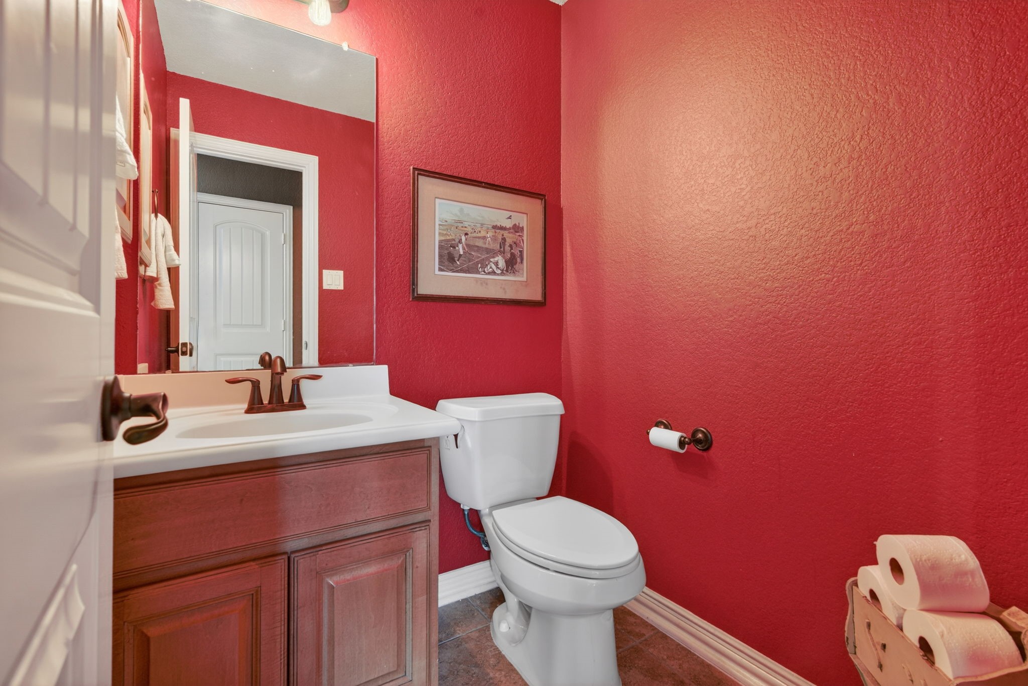 194 Maple Grove Drive Conroe, TX 77384 - Photo 20 of 25 a bathroom with a toilet a sink and mirror
