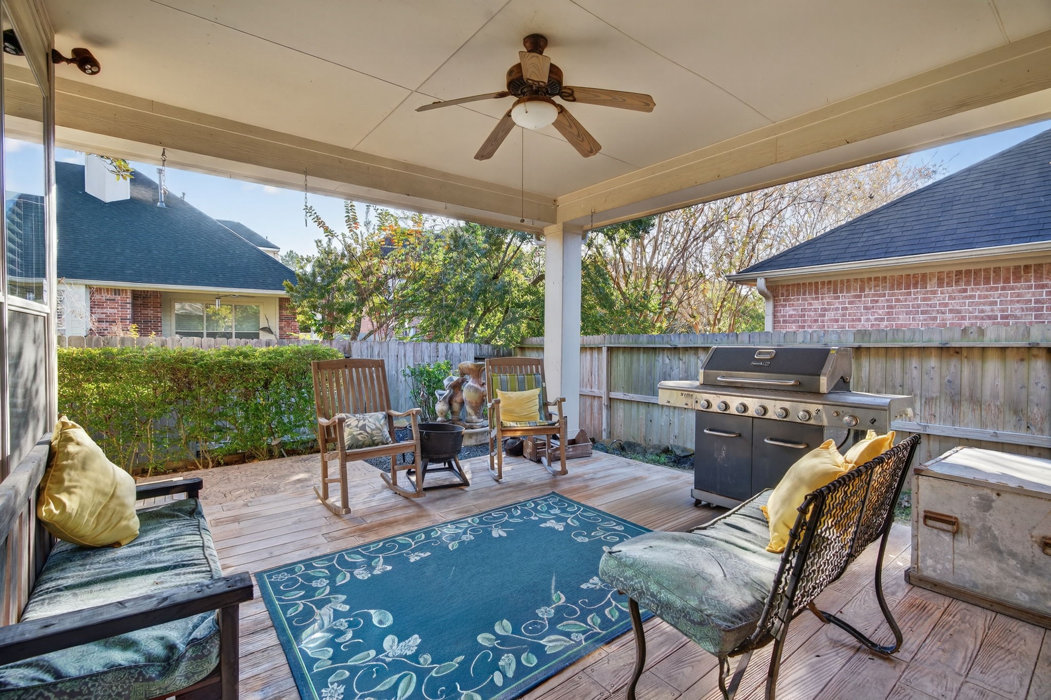 194 Maple Grove Drive Conroe, TX 77384 - Photo 21 of 25 a view of a patio with a dining table and chairs