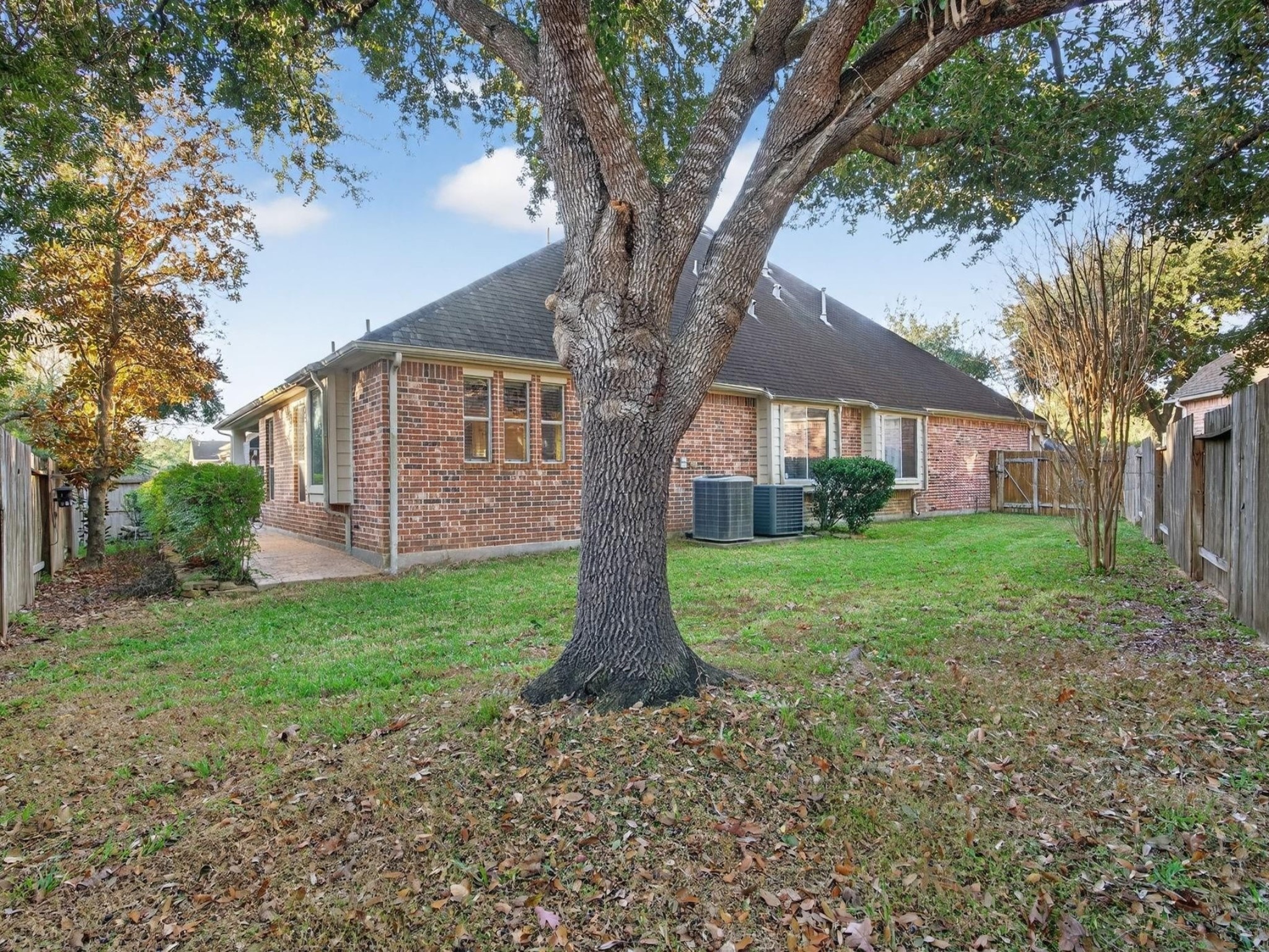 194 Maple Grove Drive Conroe, TX 77384 - Photo 23 of 25 a view of a house with backyard and garden
