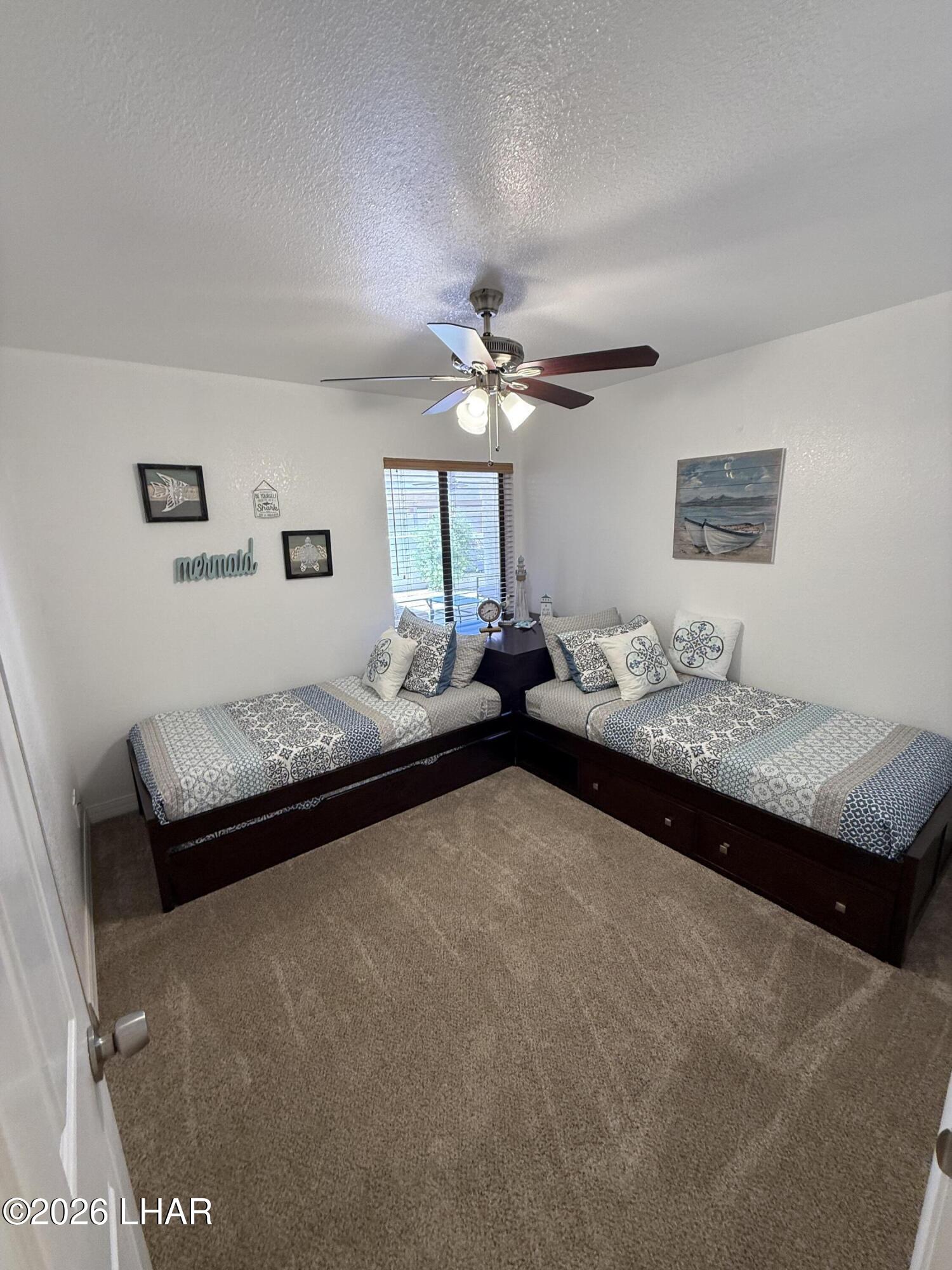 375 London Bridge Road, Unit 35 Lake Havasu City, AZ 86403 - Photo 37 of 43 BEDROOM 2 WITH TWO TWIN BEDS AND TRENDLE BEDS UNDERNEATH