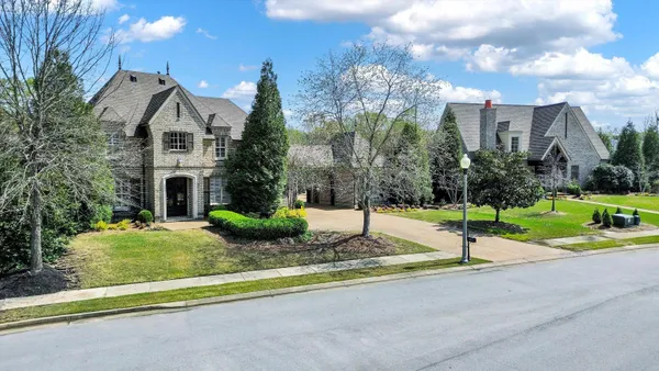 a front view of a house with porch and entertaining space
