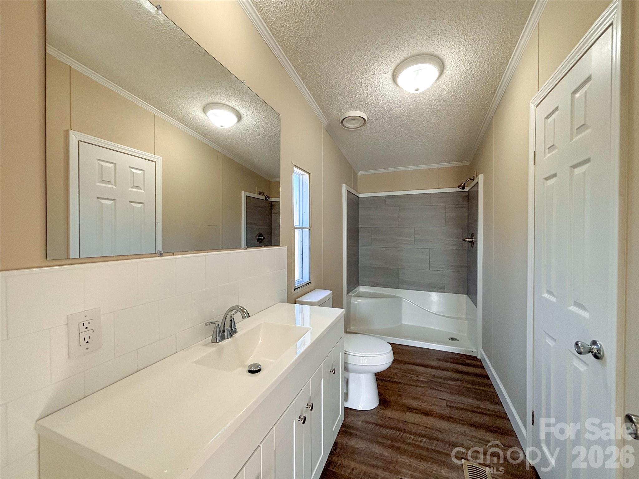 3596 Gull Street Hudson, NC 28638 - Photo 16 of 23 a spacious bathroom with a bathtub shower sink and a toilet