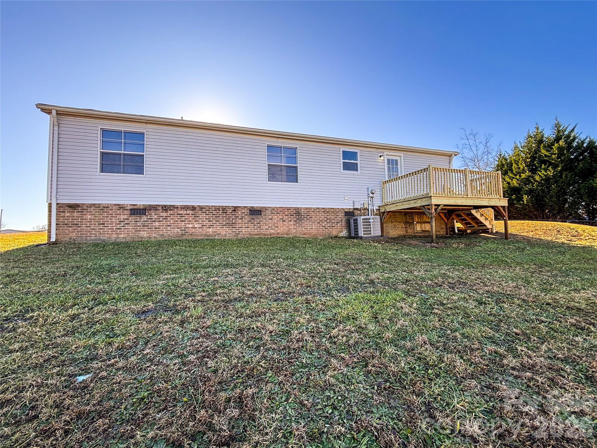 3596 Gull Street Hudson, NC 28638 - Photo 20 of 23 a view of a house with a big yard