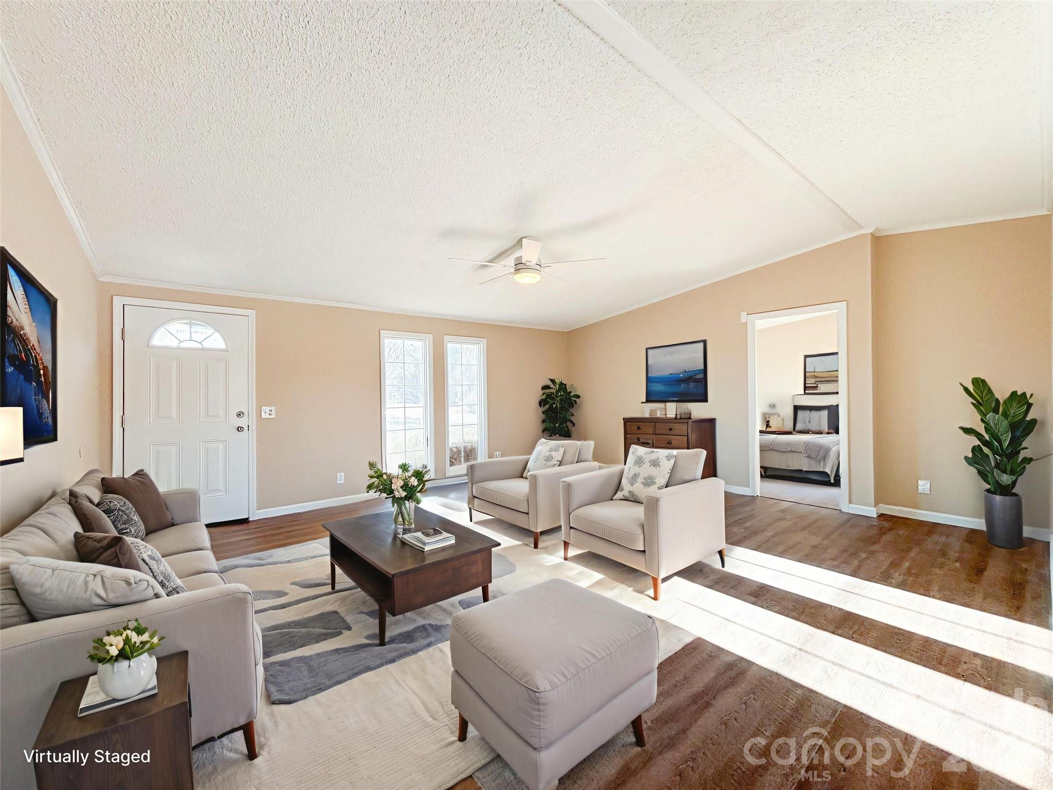 3596 Gull Street Hudson, NC 28638 - Photo 2 of 23 a living room with furniture or couch and a flat screen tv