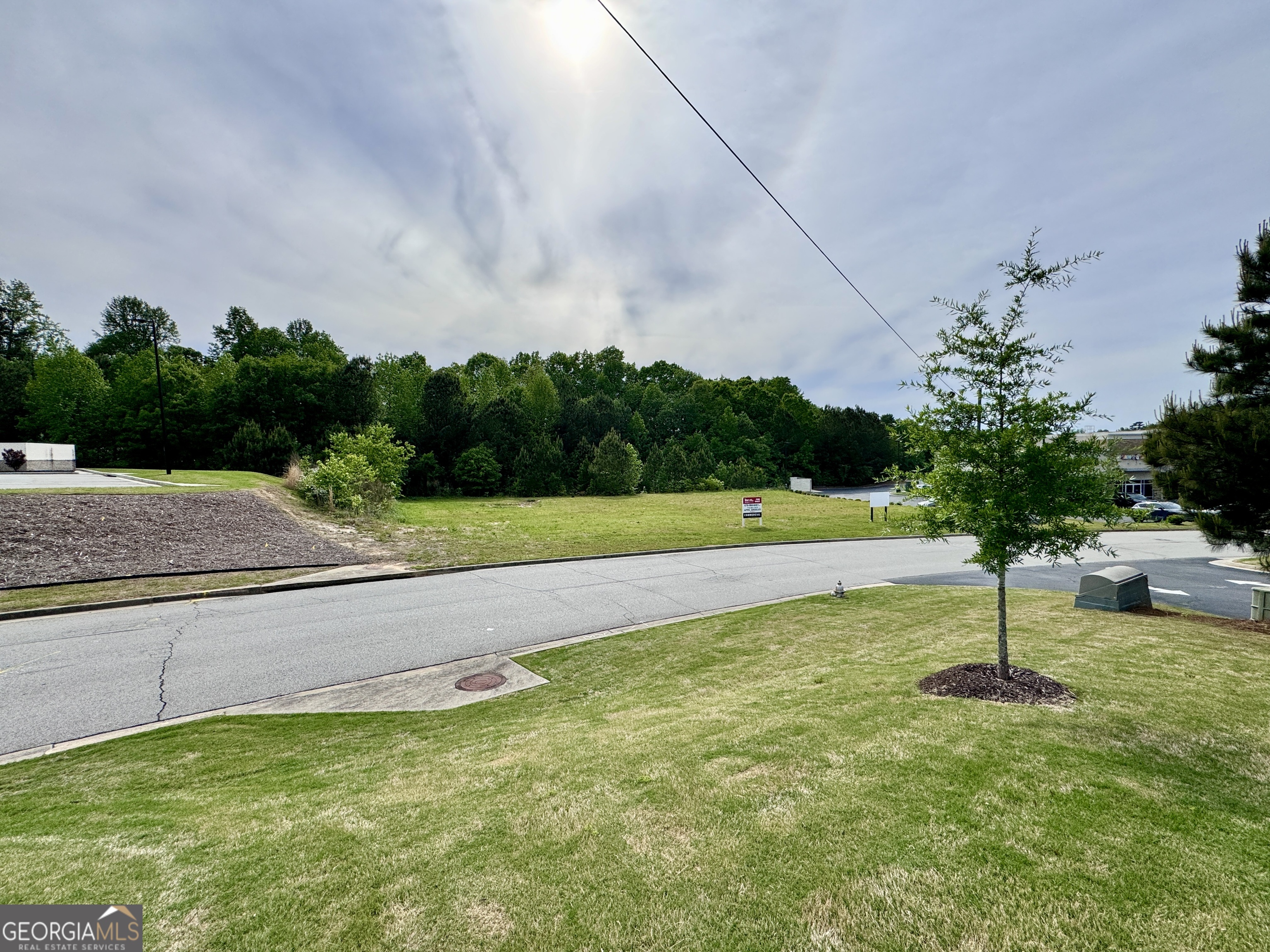 2342 Sparta Way Braselton, GA 30519 - Photo 13 of 25 a view of a garden with a bench
