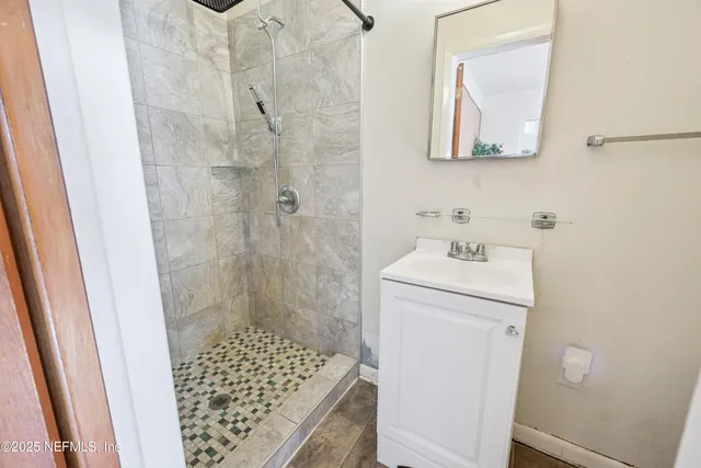 a bathroom with a sink and a shower