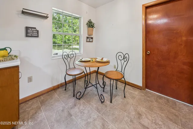 a view of a livingroom with furniture and window