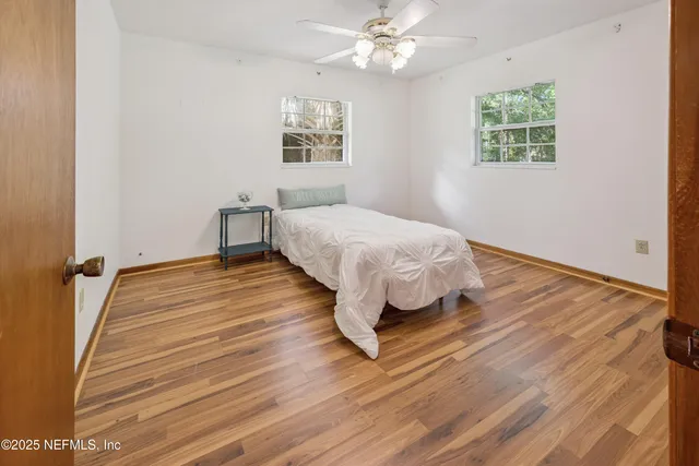 a room with a bed and a window