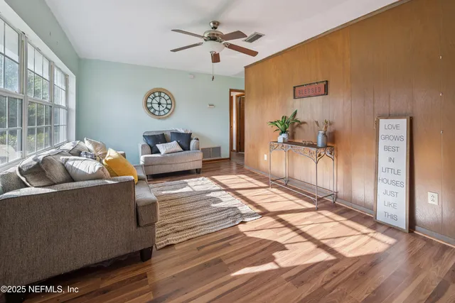 a living room with furniture and a table